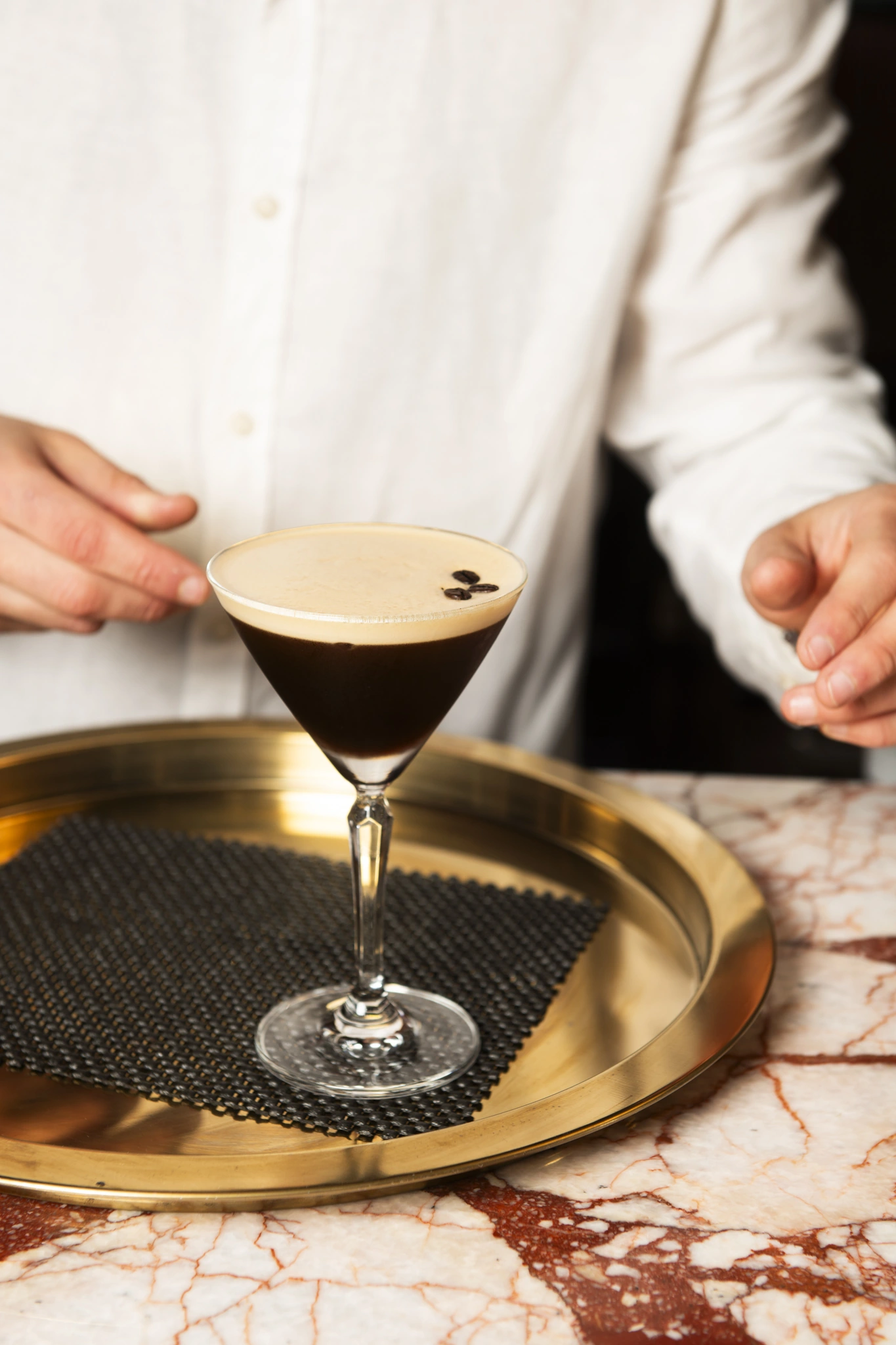 Espresso martini on a gold tray at Pukush